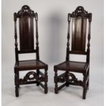 PAIR OF LATE SEVENTEENTH CENTURY OAK SIDE CHAIRS, each with scroll moulded and pierced top rail, set