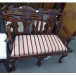 CHIPPENDALE STYLE CARVED MAHOGANY TWO CHAIR BACK SETTEE WITH DROP IN SEATS, ON THREE CABRIOLE