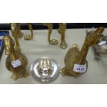 A PAIR OF BRASS DUCK FIGURES AND A SILVER PLATE CANDLESTICK