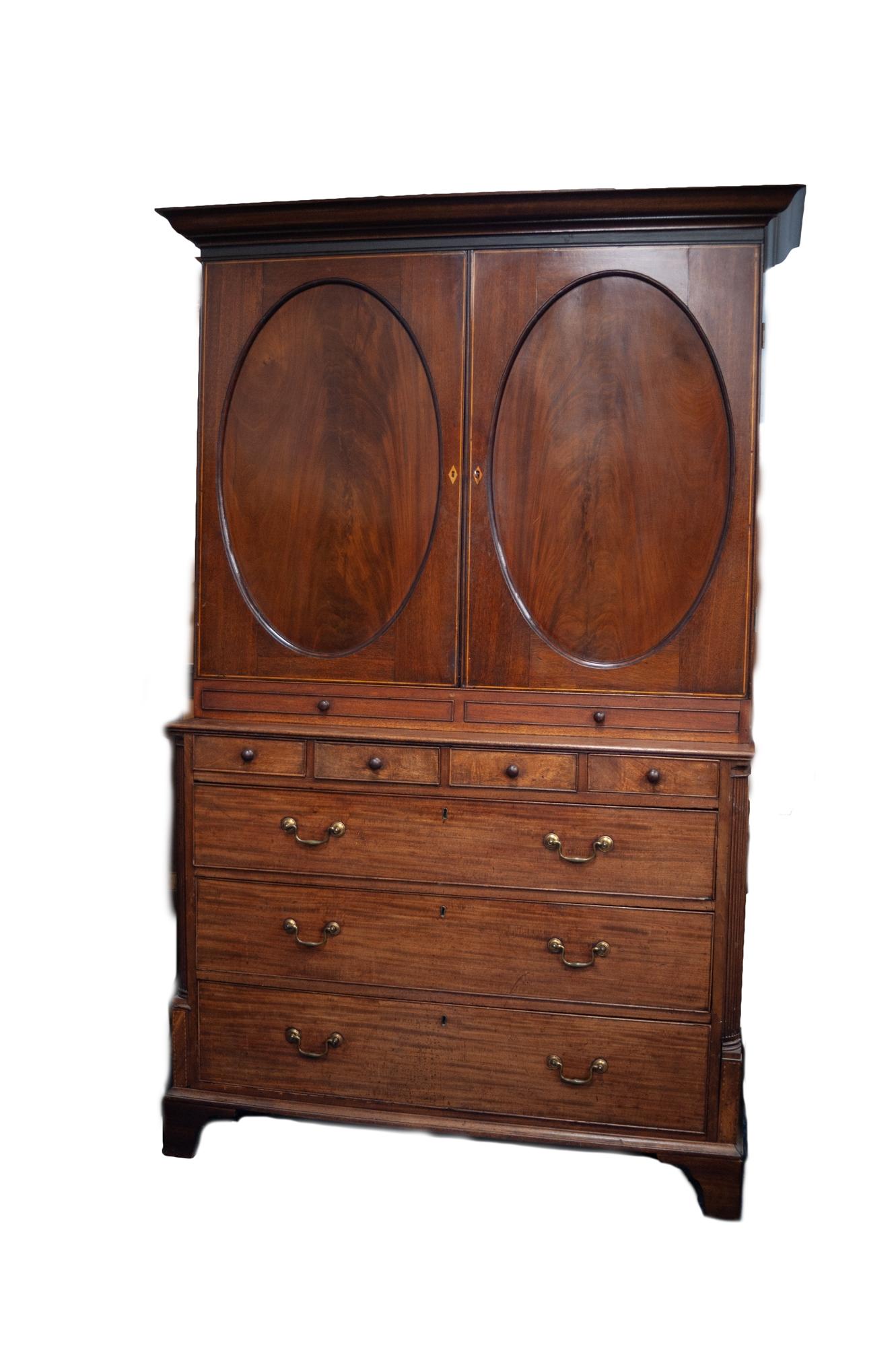 NINETEENTH CENTURY LINE INLAID FIGURED MAHOGANY COMPOSITE CUPBOARD ON CHEST, the moulded cornice