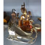 A SILVERED METAL SLEIGH ORNAMENT, TWO MODEL SPINNING WHEELS, A MODEL ROCKING CHAIR, TWO PLASTIC
