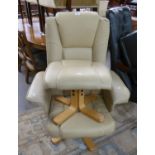 A CREAM LEATHER RECLINING ARMCHAIR ON ROTATING FIVE SPUR BASE AND A MATCHING FOOT STOOL (2)