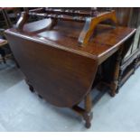 A LARGE OAK OVAL GATELEG DINING TABLE, ON BALUSTER SUPPORTS, APPROX 6' X 3'6"