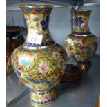 A PAIR OF ORIENTAL CLOISONNE ENAMELLED VASES, ON WOODEN STANDS, 11 1/2" HIGH OVERALL