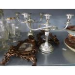 A PAIR OF ELECTROPLATE THREE LIGHT CANDLEBRA AND A PAIR OF FANCY COPPER EASEL PHOTOGRAPH FRAMES