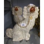 A PAIR OF VICTORIAN STAFFORDSHIRE OTTERY MANTEL DOGS, 12" HIGH