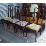 A SET OF FDUR MAHOGANY QUEEN ANNE STYLE DINING CHAIRS