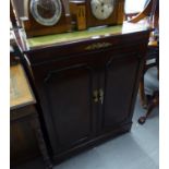 A MAHOGANY TWO DOOR TELEVISION CABINET