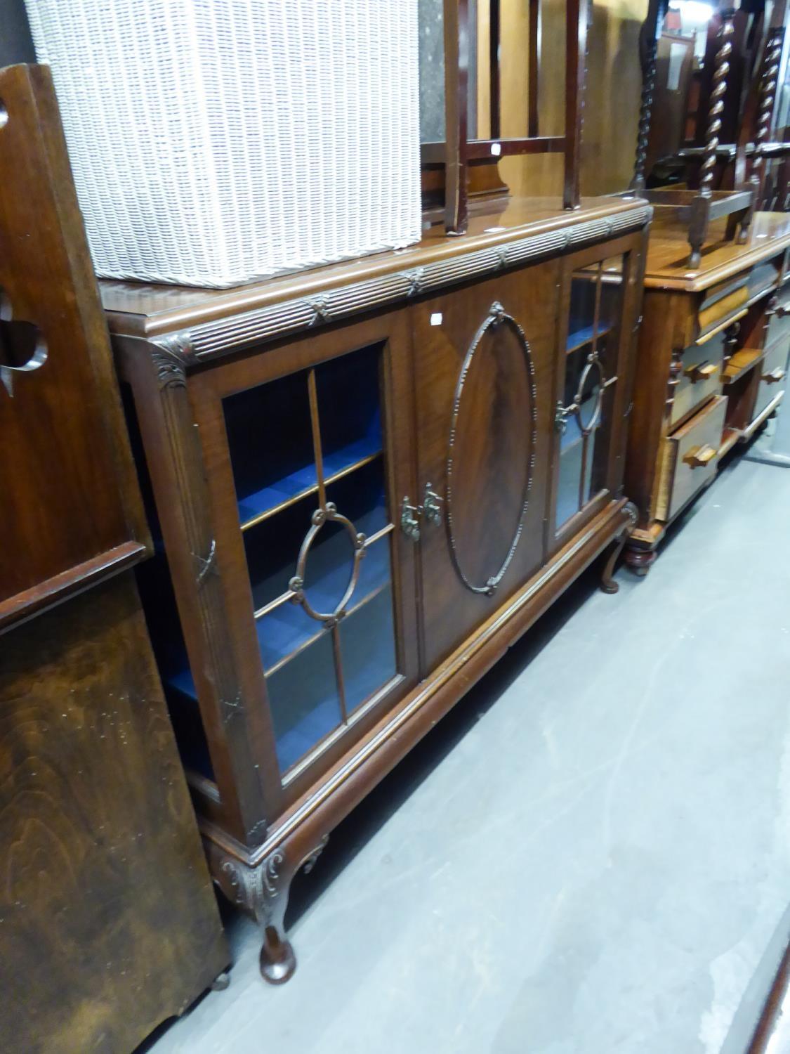 MAHOGANY SMALL DISPLAY CABINET WITH LEDGE BACK, CENTRE PANEL DOOR, FLANKED BY GLAZED PANEL DOORS,