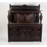 JACOBEAN STYLE CARVED DARK OAK COURT CUPBOARD, the oblong top with low back, set above a pair of