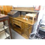 ?EDWARDIAN OAK SIDEBOARD, HAVING RAISED MIRROR BACK, THE SHELF OVER THREE BEVEL GLASS SECTIONS,