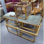 A LARGE BAMBOO COFFEE TABLE WITH GLASS TOP, A PAIR OF SIMILAR BAMBOO FOOTSTOOLS WITH UPHOLSTERED