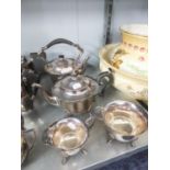 ELECTROPLATE TEA SERVICE OF 4 PIECES HAVING SHAPED RIMS, EBONISED HANDLES, ALL RAISED ON SHAPED FEET