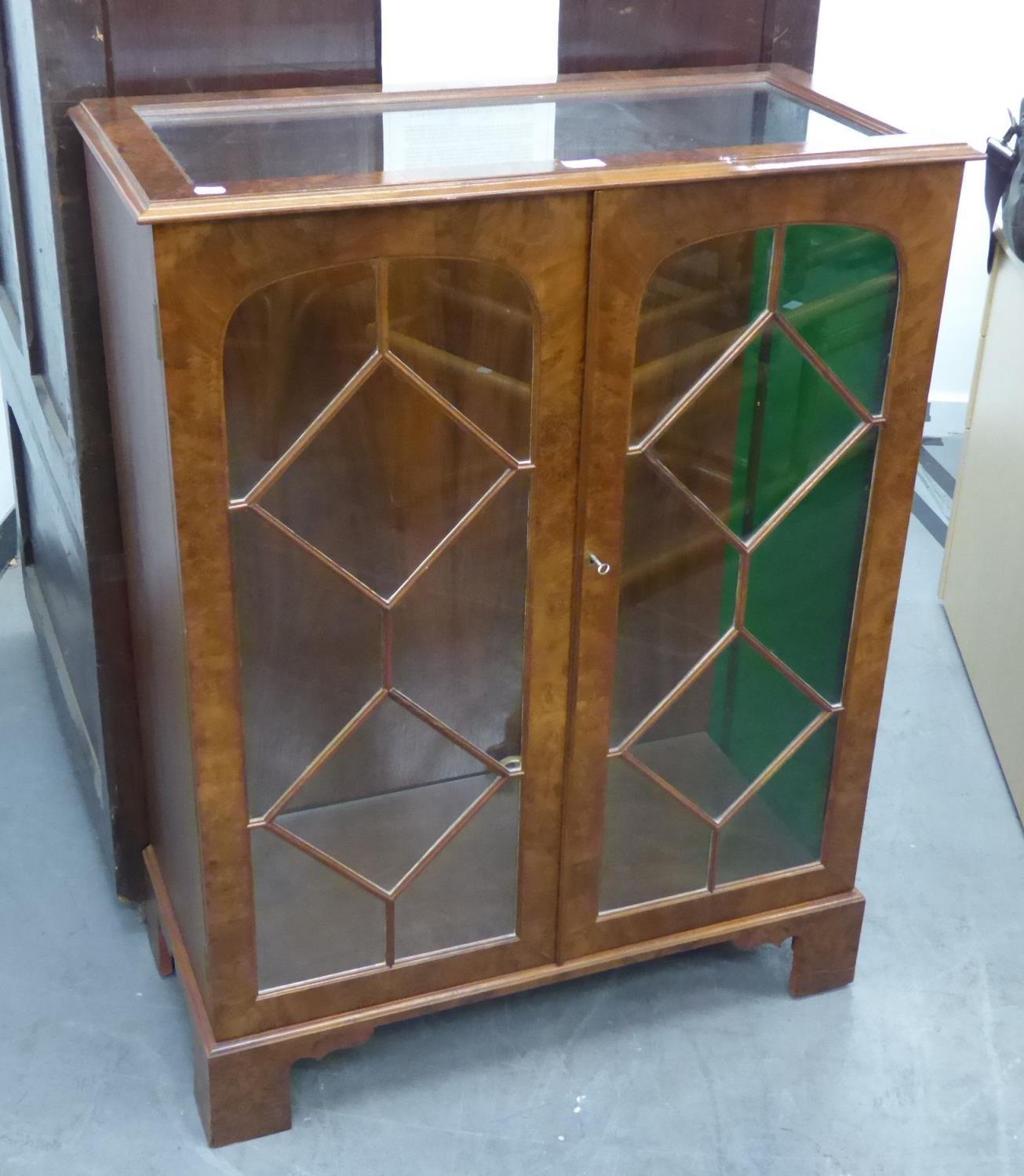 A 1930's WALNUTWOOD DISPLAY CABINET WITH TWO GLASS SHELVES