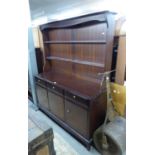 A MAHOGANY 'STAG' DRESSER, HAVNG THREEE DRAWERS ABOVE THREEE CUPBOARDS, THE UPPER SECTION HAVING