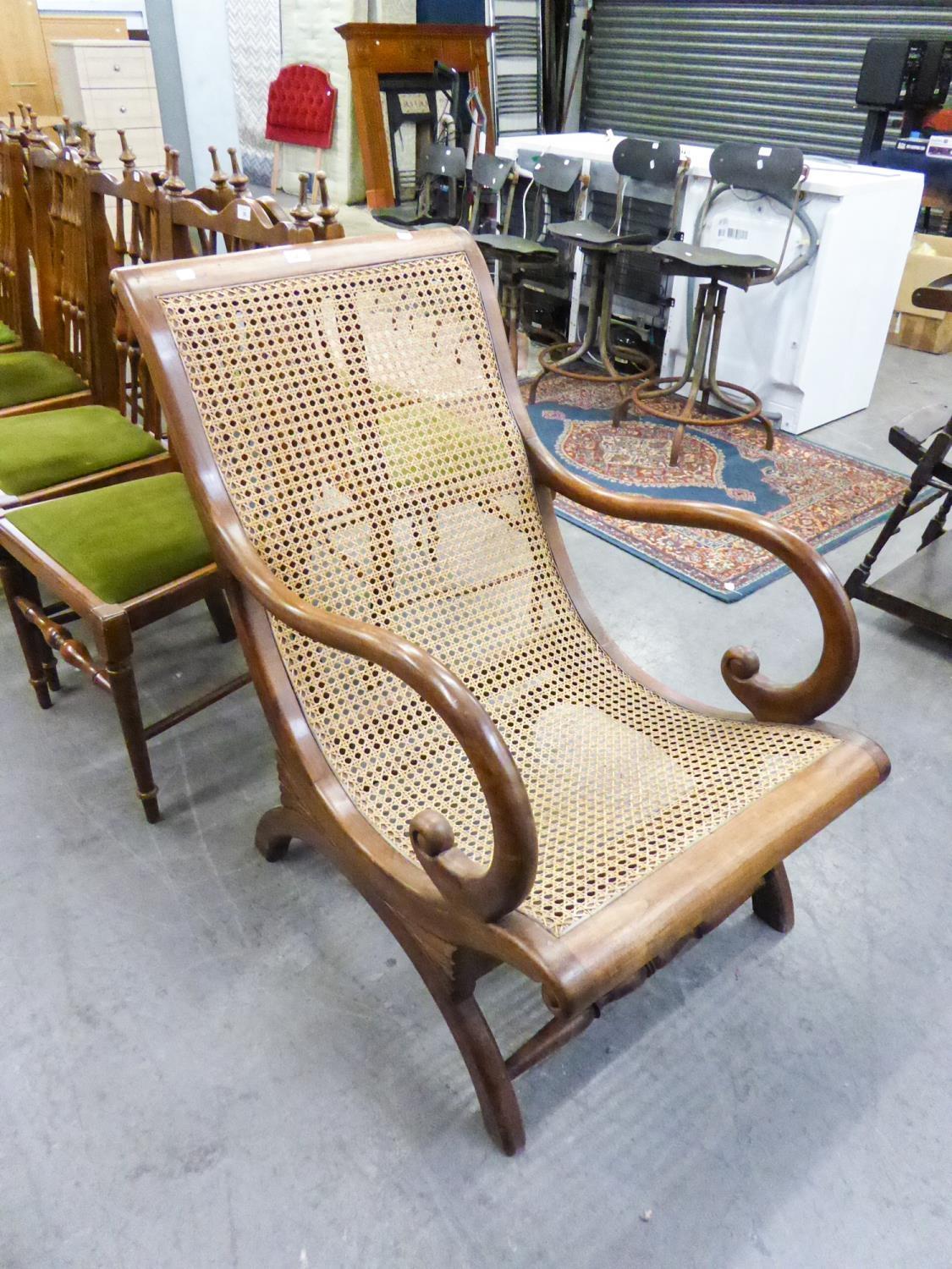 LARGE MAHOGANY FRAMED ARMCHAIR, HAVING CANE SEAT AND BACK