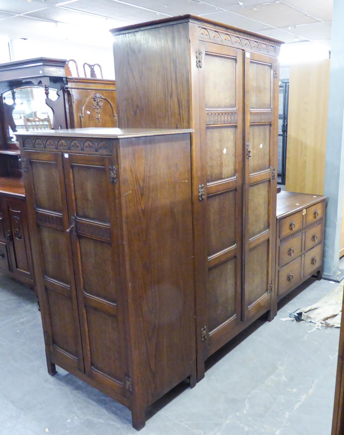 WARING & GILLOWS (1932) OAK TWO DOOR CARVED WARDROBE, (189cm high, 97cm wide) A MATCHING TALLBOY/