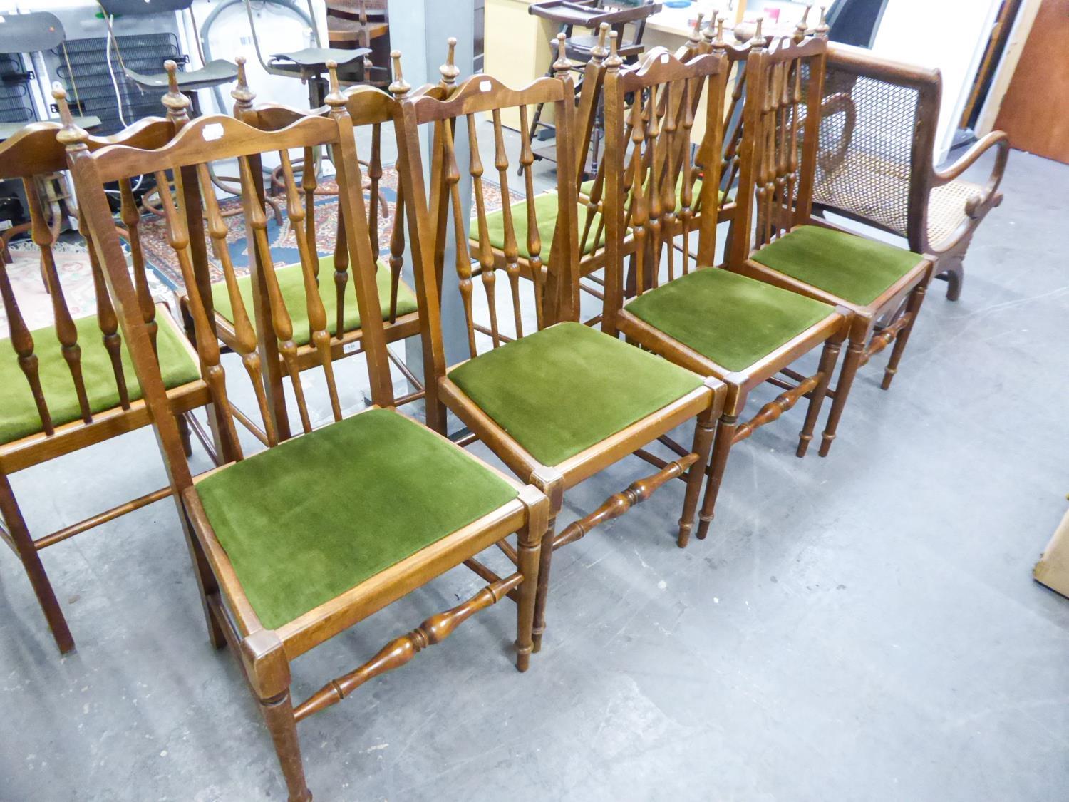 SET OF FOUR HARDWOOD SINGLE CHAIRS EACH WITH TALL SPINDLE BACKS AND DROP-IN SEATS IN GREEN PLUSH