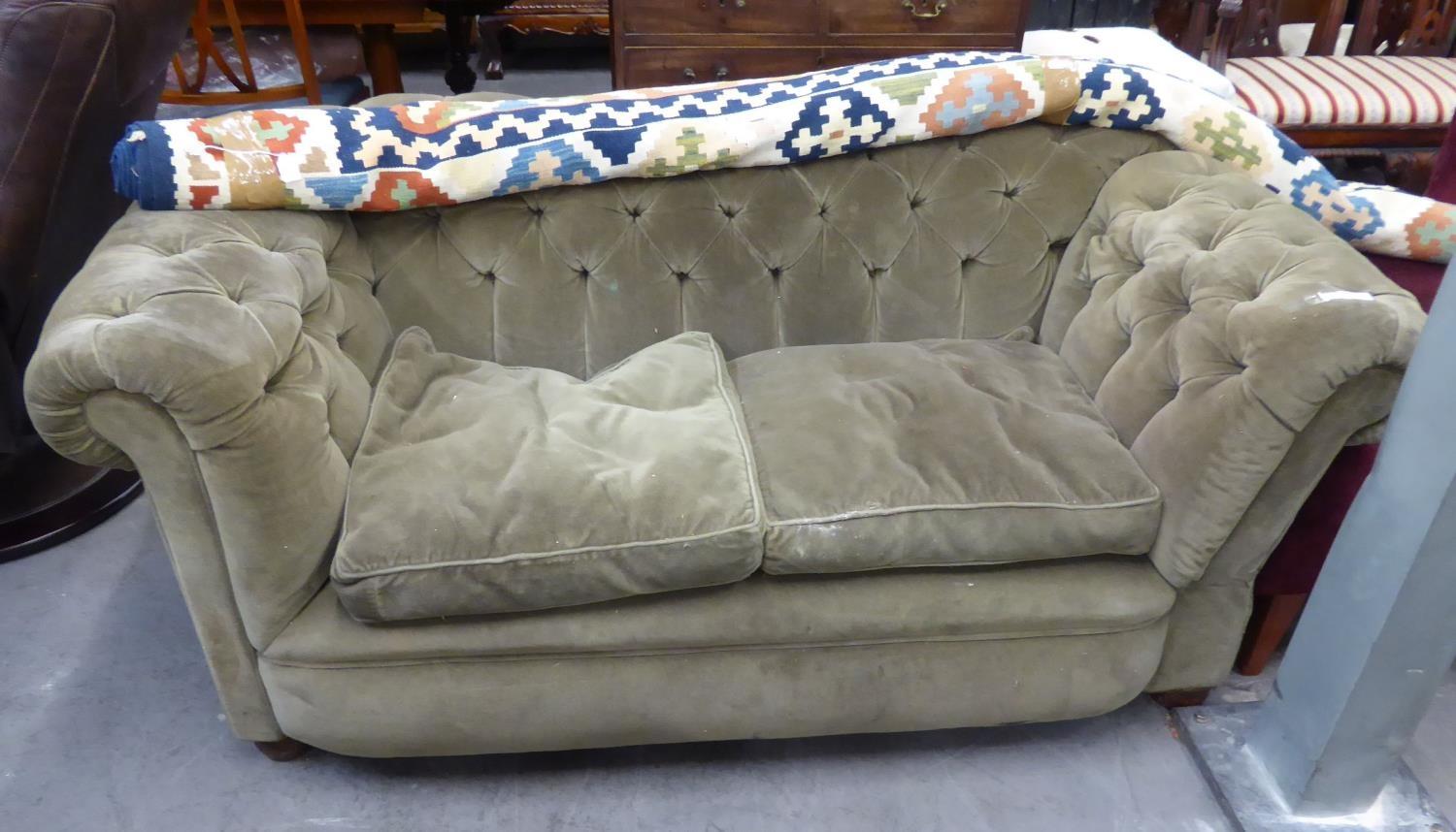 A VICTORIAN CHESTERFIELD SOFA HAVING BUTTON BACK AND ARMS, HAVING DROP ARM TO ONE END, IN GREEN