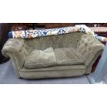 A VICTORIAN CHESTERFIELD SOFA HAVING BUTTON BACK AND ARMS, HAVING DROP ARM TO ONE END, IN GREEN