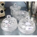 A PAIR OF 20TH CENTURY CUT GLASS CIRCULAR TRINKET DISHES WITH COVERS, POWDER JAR ANS COVER AND A
