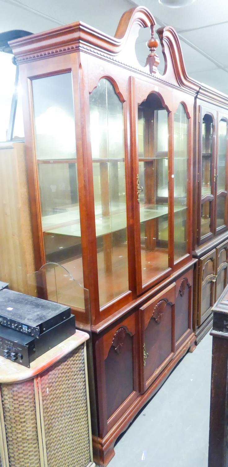 GEORGIAN STYLE MAHOGANY DISPLAY CABINET WITH BROKEN ARCH PEDIMENT, MIRRORED INTERIORS, CUPBOARD BASE