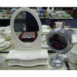 A WHITE FINISH OVAL SWING MIRROR WITH THREE DRAWERS, No. 7 CHROMED METAL MAKE UP MIRROR WITH LIGHT