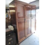 BLIND FRET CARVED MAHOGANY BEDROOM SUITE OF THREE PIECES, VIZ A THREE DOOR WARDROBE, 5' 3" WIDE, A