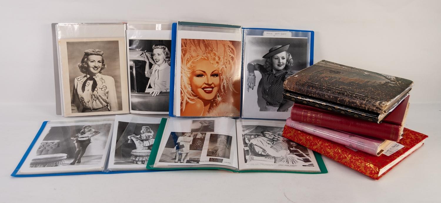 NINE ALBUMS CONTAINING A COLLECTION OF BETTY GRABLE BLACK AND WHITE STILLS, PROMOTIONAL