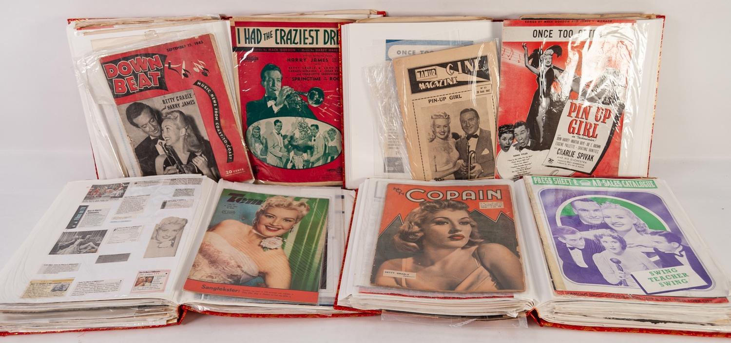 FOUR LARGE ALBUMS OF MAGAZINES AND COVERS FEATURING BETTY GRABLE, (4)