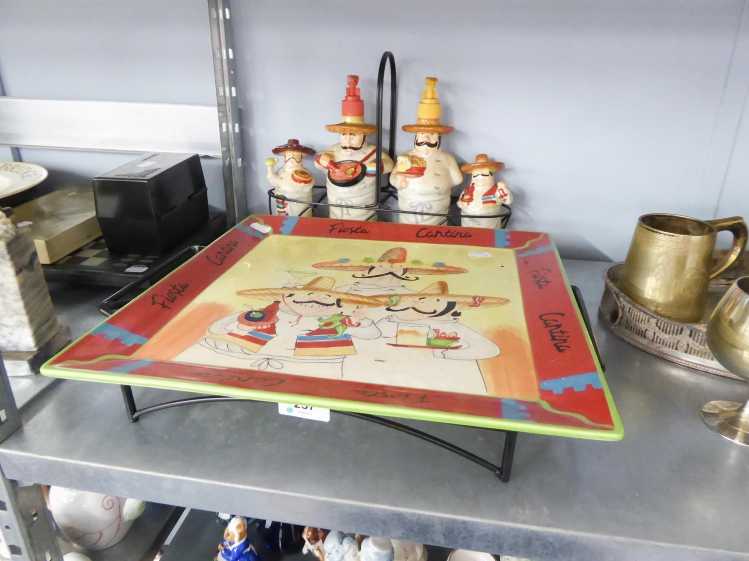 SET OF FOUR MEXICAN FIGURE SAUCE BOTTLES AND HOLDER AND A LARGE PLATE AND TRAY.