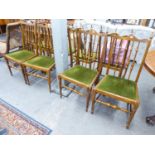 SET OF FOUR HARDWOOD SINGLE CHAIRS EACH WITH TALL SPINDLE BACKS AND DROP-IN SEATS IN GREEN PLUSH