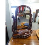 A VICTORIAN MAHOGANY SHAPED SWING TOILET MIRROR, SCROLL ARM SUPPORTS OVER CENTRAL DRAWER TO THE BASE
