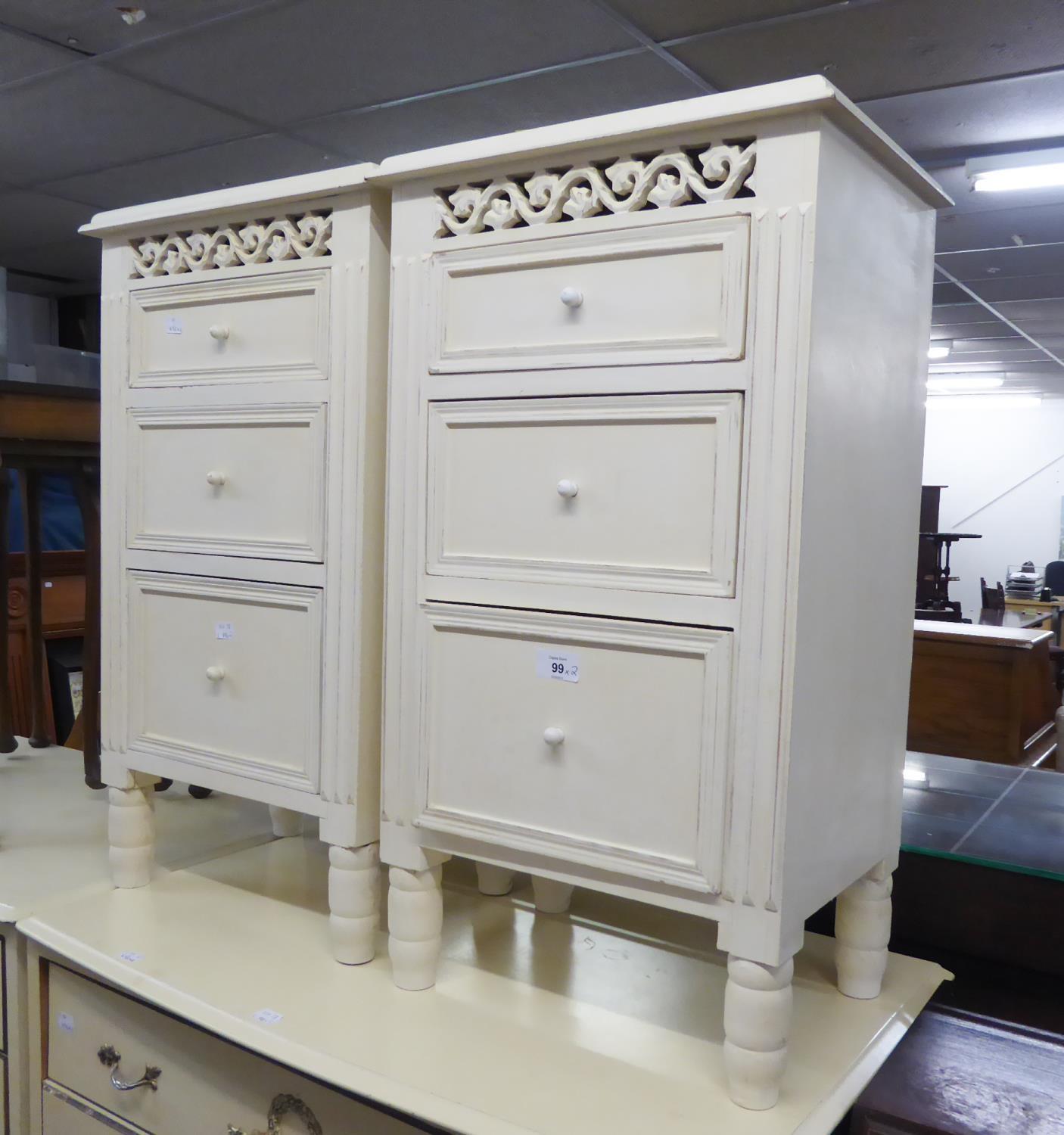 A PAIR OF THREE DRAWER BEDSIDE CHESTS (2)