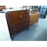 A MAHOGANY TALLBOY WITH TWO DOORS ABOVE THREE LONG DRAWERS, RAISED ON SHORT CABRIOLE LEGS AND AN OAK