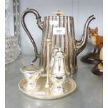 AN ELECTROPLATED COFFEE POT AND A CRUET SET