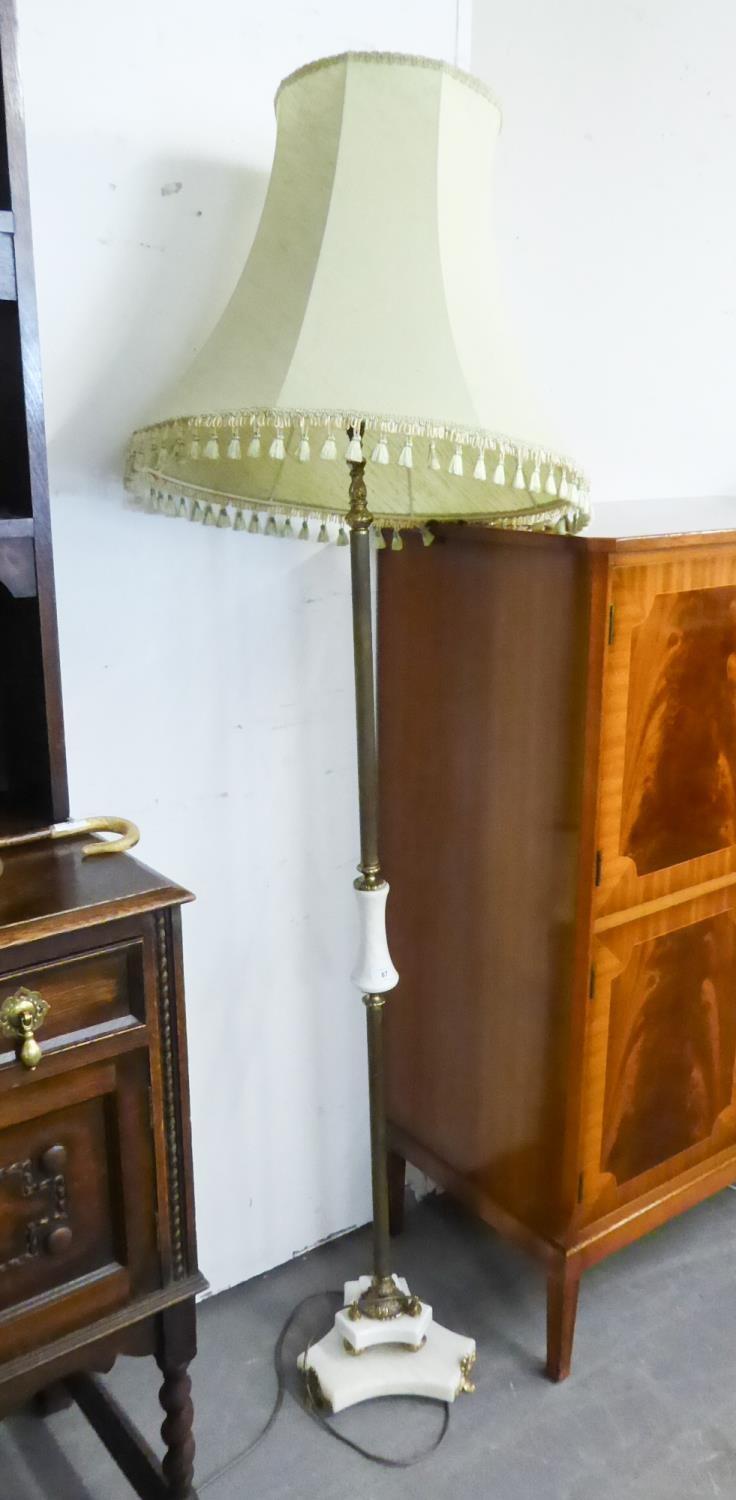 A BRASS AND ONYX STANDARD LAMP WITH SILK SHADE