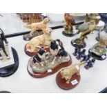 A MODEL BESWICK FIGURE OF A GOLDEN RETRIEVER ON A PLINTH AND TWO BORDER FINE ARTS OF DOGS ON