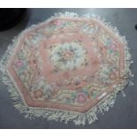 AN OCTAGONAL CHINESE RUG, PINK GROUND, OF AUBUSSON FLORAL DESIGN