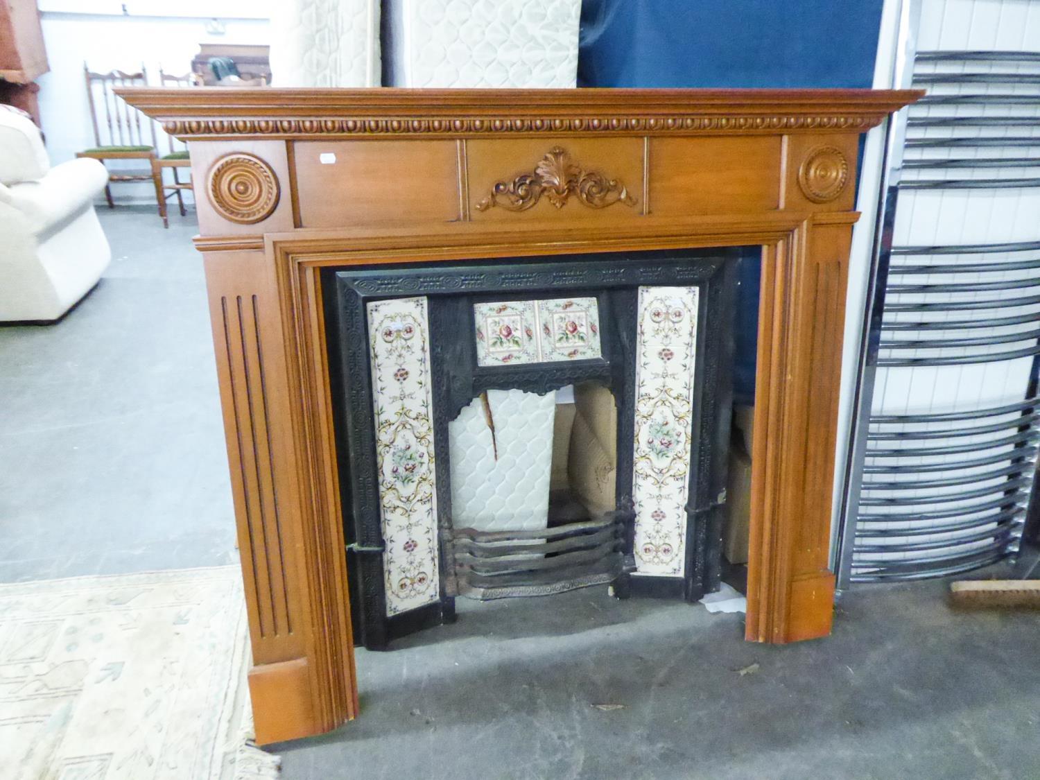 VICTORIAN FIRE INSET HAVING FLORAL TILES, WITH LATER CARVED FIRE SURROUND