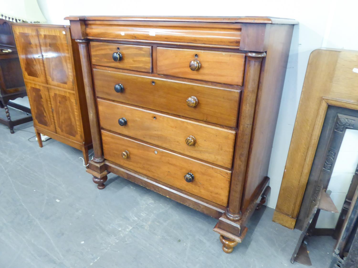 A LARGE VICTORIAN CHEST OF DRAWERS, TWO SHORT OVER THREE LONG DRAWERS AND A FRIEZE DRAWER ABOVE,