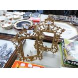 A PAIR OF GILT CAST METAL STAND PICTURE FRAMES
