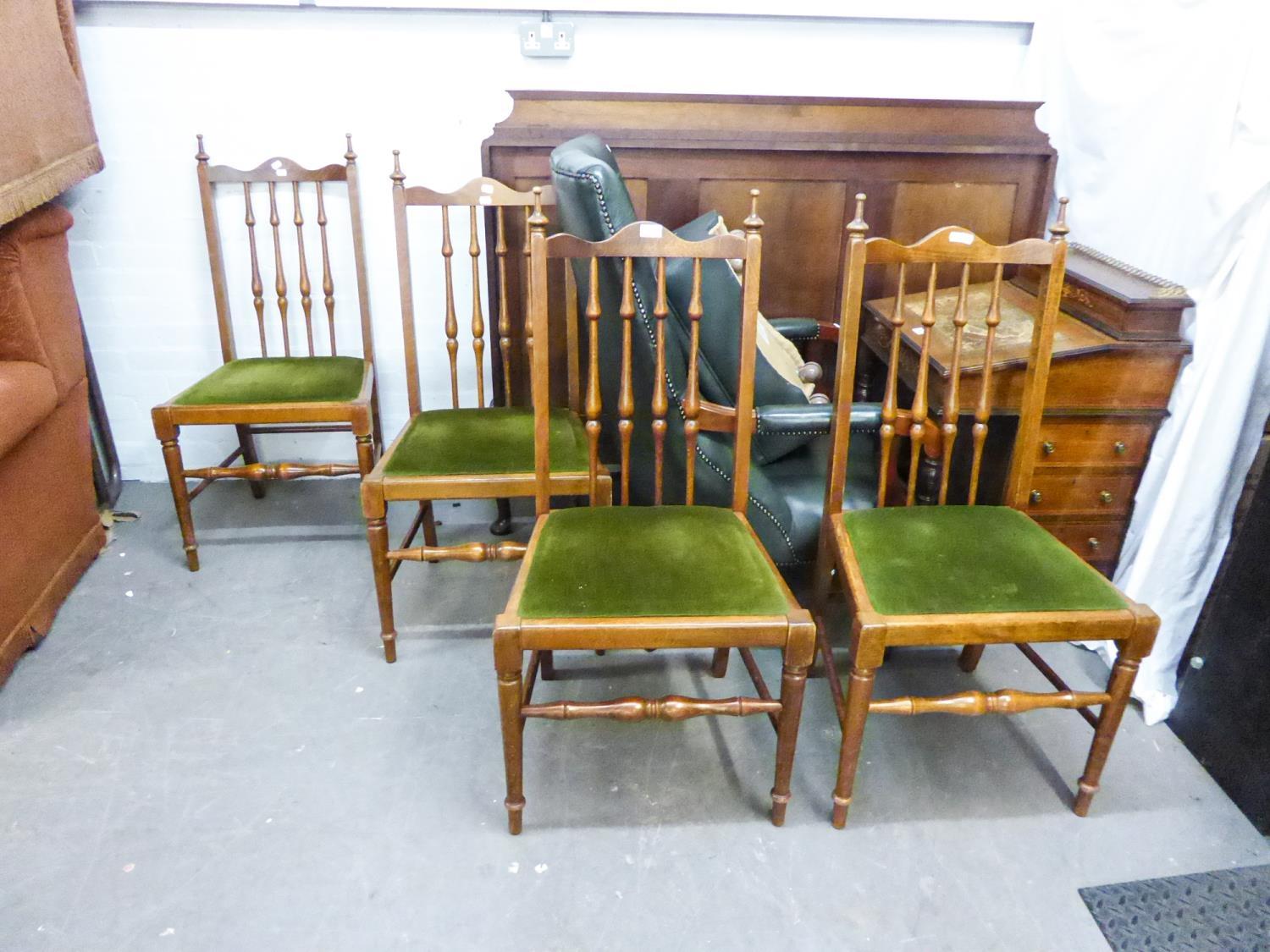 SET OF FOUR HARDWOOD SINGLE CHAIRS EACH WITH TALL SPINDLE BACKS AND DROP-IN SEATS IN GREEN PLUSH