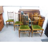 SET OF FOUR HARDWOOD SINGLE CHAIRS EACH WITH TALL SPINDLE BACKS AND DROP-IN SEATS IN GREEN PLUSH