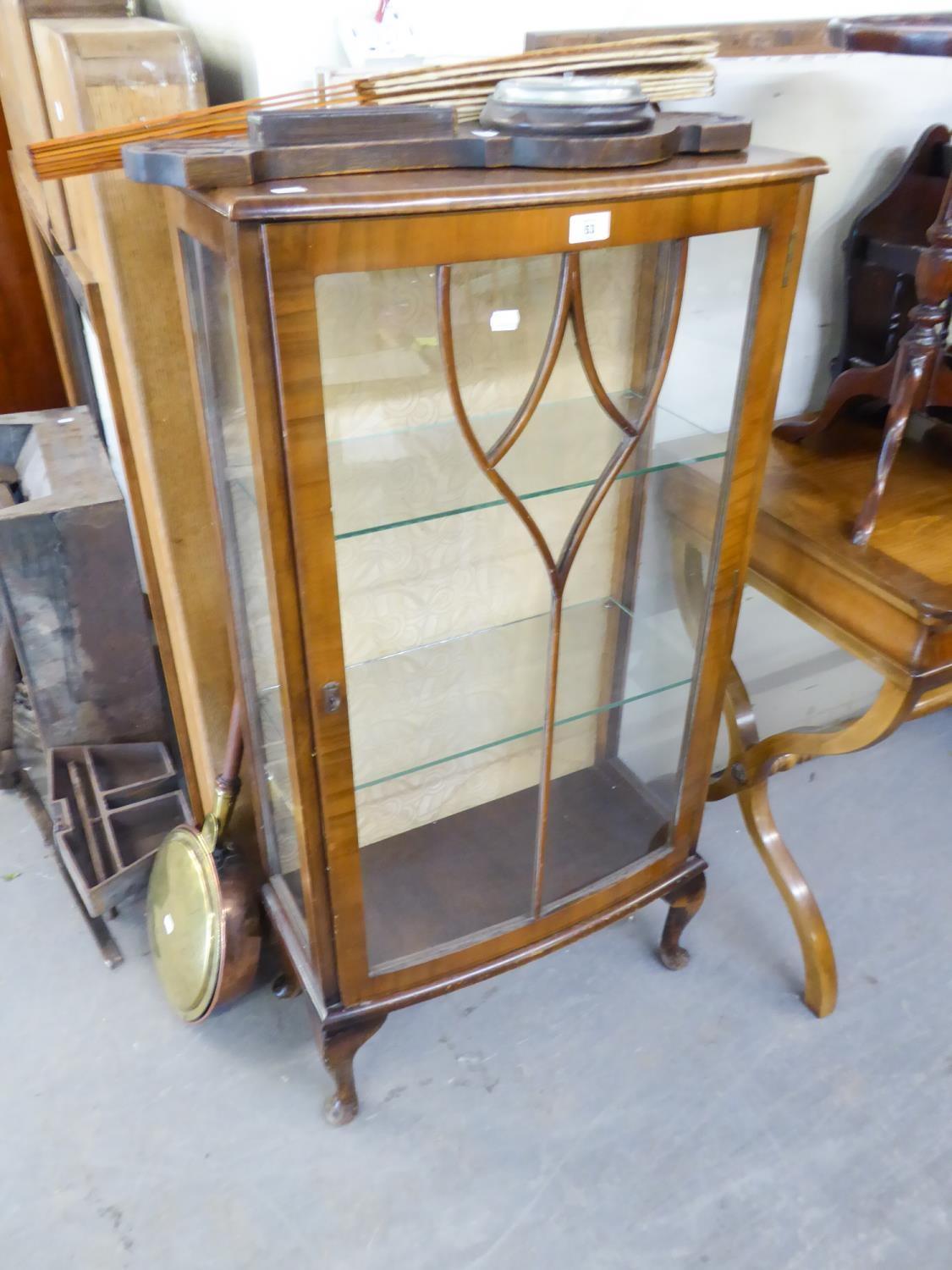 A SMALL NARROW GLAZED DISPLAY CABINET, RAISED ON CABRIOLE LEGS