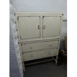 AN OAK CUPBOARD ON CHEST HAVING SPIRAL LEGS, PAINTED AND DISTRESSED