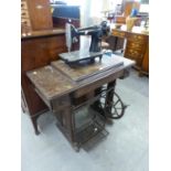 SINGER SEWING MACHINE in walnutwood cabinet AND ANOTHER SINGER SEWING MACHINE detached from oak base