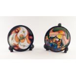 PAIR OF MODERN MOORCROFT TUBE LINED POTTERY CIRCULAR PIN DISHES IN OAK FRAMES, one decorated two