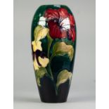 WALTER MOORCROFT HIBISCUS PATTERN TUBE LINED POTTERY VASE, of slender ovoid form, painted in tones