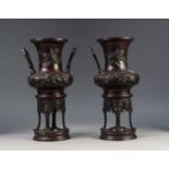 PAIR OF JAJPANESE LATE MEIJI PERIOD TWO HANDLED PATINATED SPELTER VASES OR KOROS, each of campana